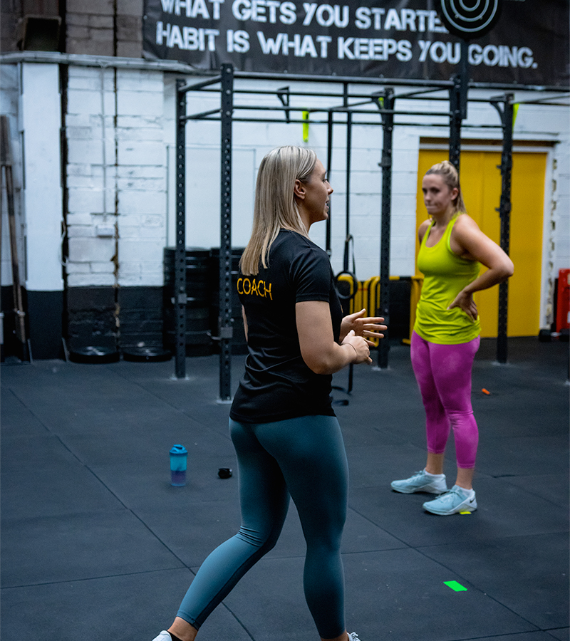 CrossFit coaches working out in the gym